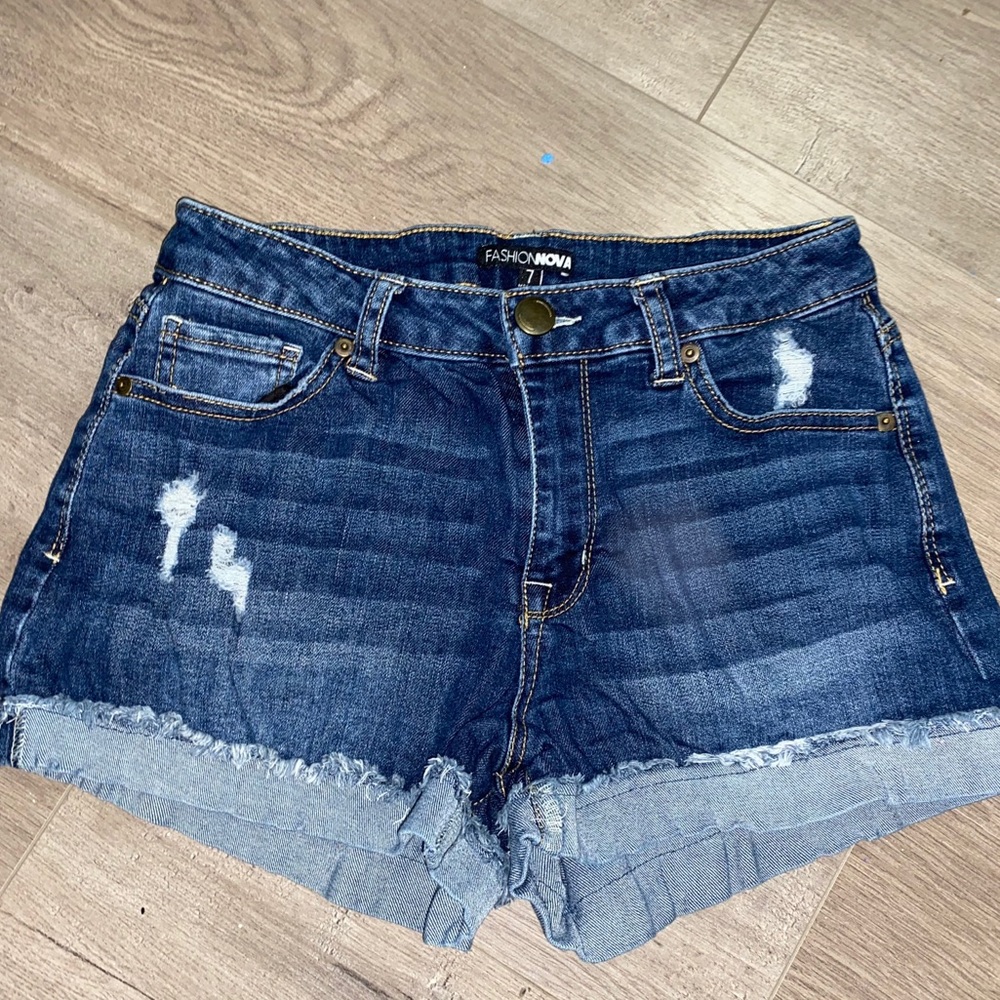 A dark wash pair of fashion nova jean shorts